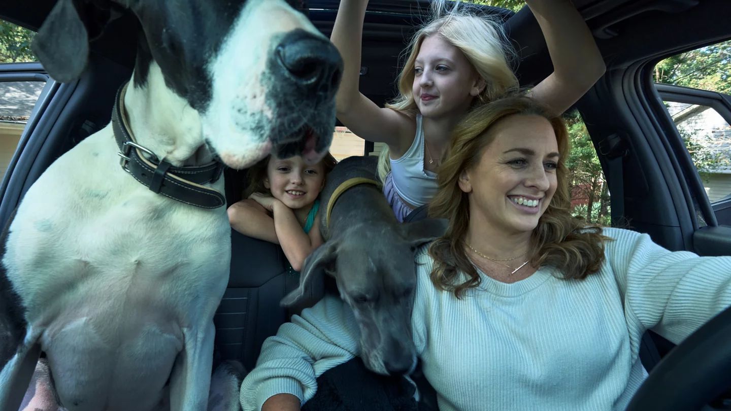 Two women and a Great Dane inside a Hyundai