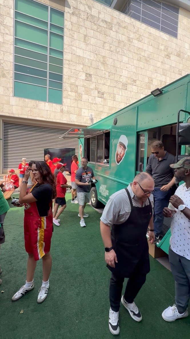 Fans collecting free food and swag from the truck