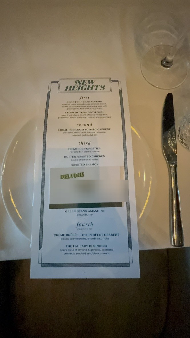 A custom New Heights dinner menu with a personalized welcome card