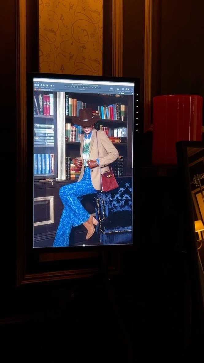An editorial portrait on the studio monitor during live review